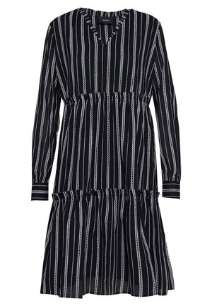 Robe à manches longues avec un décolleté en V, ornée de rayures verticales noires et blanches et d'un ourlet en volant. La taille est cintrée pour créer une silhouette.