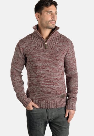 Pulover tricotat în nuanță de vișiniu, cu guler înalt, închidere cu fermoar pe jumătate, manșete și talie ribbate. Materialul prezintă un model texturat, melanj.