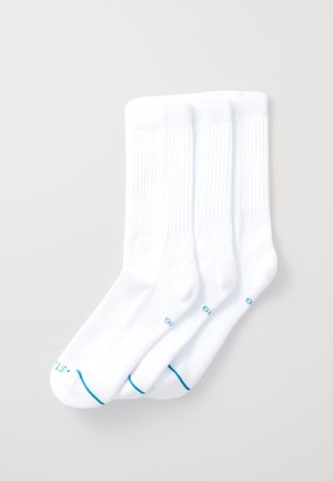 Drei Paar weiße Socken mit geripptem Design, kontrastierenden blauen Akzenten an den Bündchen und glatter Textur.