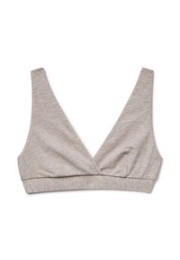 Bralette morbido di colore beige chiaro con scollo a V profondo, spalline larghe e una fascia elastica sottostante per il supporto, esposto su uno sfondo bianco.