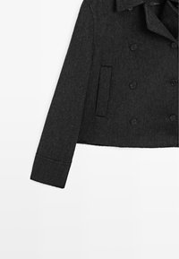 Black wool-blend cropped jacket with double-breasted button closure, notched collar, and a single side pocket; textured finish.