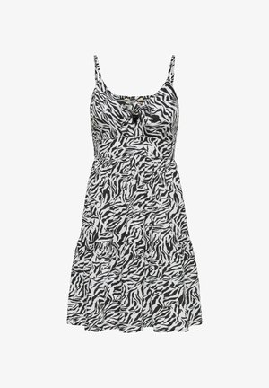 Šaty s černo-bílým zebrovým vzorem, tenkými ramínky, přiléhavým korzetem a rozšířenou sukní, se zavázaným detailem vpředu a tíženou konstrukcí.