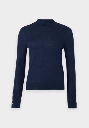 Navy blue long-sleeve sweater featuring a high neck and button accents on the cuff, made from a textured, lightweight fabric.