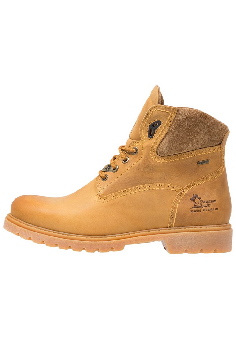 Botines de cuero marrón con acentos de ante, puntera redonda, cuello acolchado y suela de goma duradera. Presenta costuras decorativas y branding.
