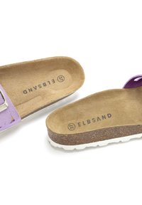 Purple suede sandals with a cork footbed and textured rubber sole. Features silver-tone buckle and printed branding on insole.