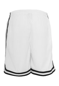 Shorts de sport blancs en tissu en maille, avec des rayures latérales noires et un ourlet noir, dotés d'une taille élastique.