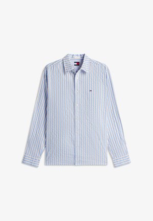 Koszula na długi rękaw na guziki z pionowymi niebieskimi, białymi i beżowymi paskami oraz małym logo Tommy Hilfiger na piersi.