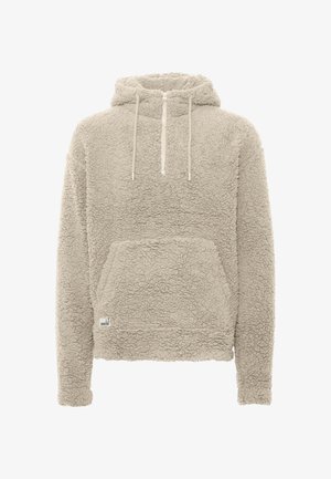 Beige fleece-hoodie med en tekstureret, blød overflade, frontlomme og halv lynlås i halsen. Den har snoretræk og ribkantede ærmer.