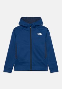 Sweatshirt com fecho éclair na cor azul marinho, feito de um tecido suave. Apresenta um capuz, bolsos com fecho éclair e o logótipo no peito. Textura suave, corte atlético.