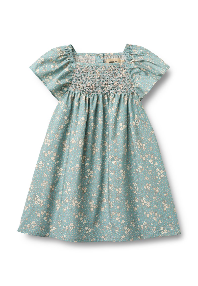 Svetlomodra cvetlična obleka s kratkimi napihnjenimi rokavi, rahlo nabrana na prsnem delu ter nabranim krilom. Vzorec majhnih kremnih cvetov.