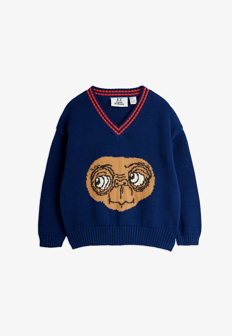 Granatowy sweter dziergany z dekoltem w V i czerwonymi akcentami. Z przodu znajduje się duży grafika twarzy ET w kolorze beżowym i kremowym. Ściągacze przy mankietach i dolnym brzegu.