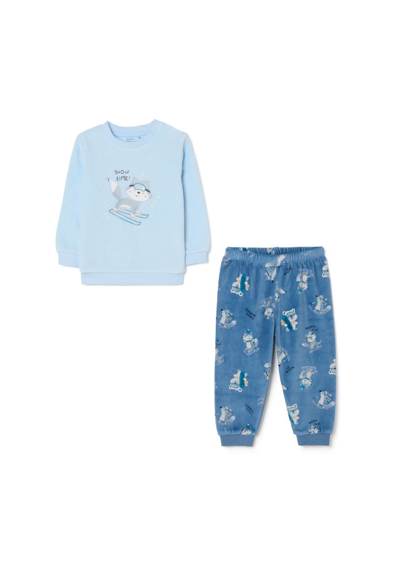 Haut à manches longues bleu clair avec un graphisme de chat en train de skier, associé à un pantalon bleu décoré d'imprimés d'animaux de ski. Tissu doux.