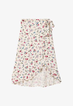 Jupe portefeuille crème avec imprimé floral rose, bleu et violet, ourlet à volants nouée à la taille par un nœud sur le côté.