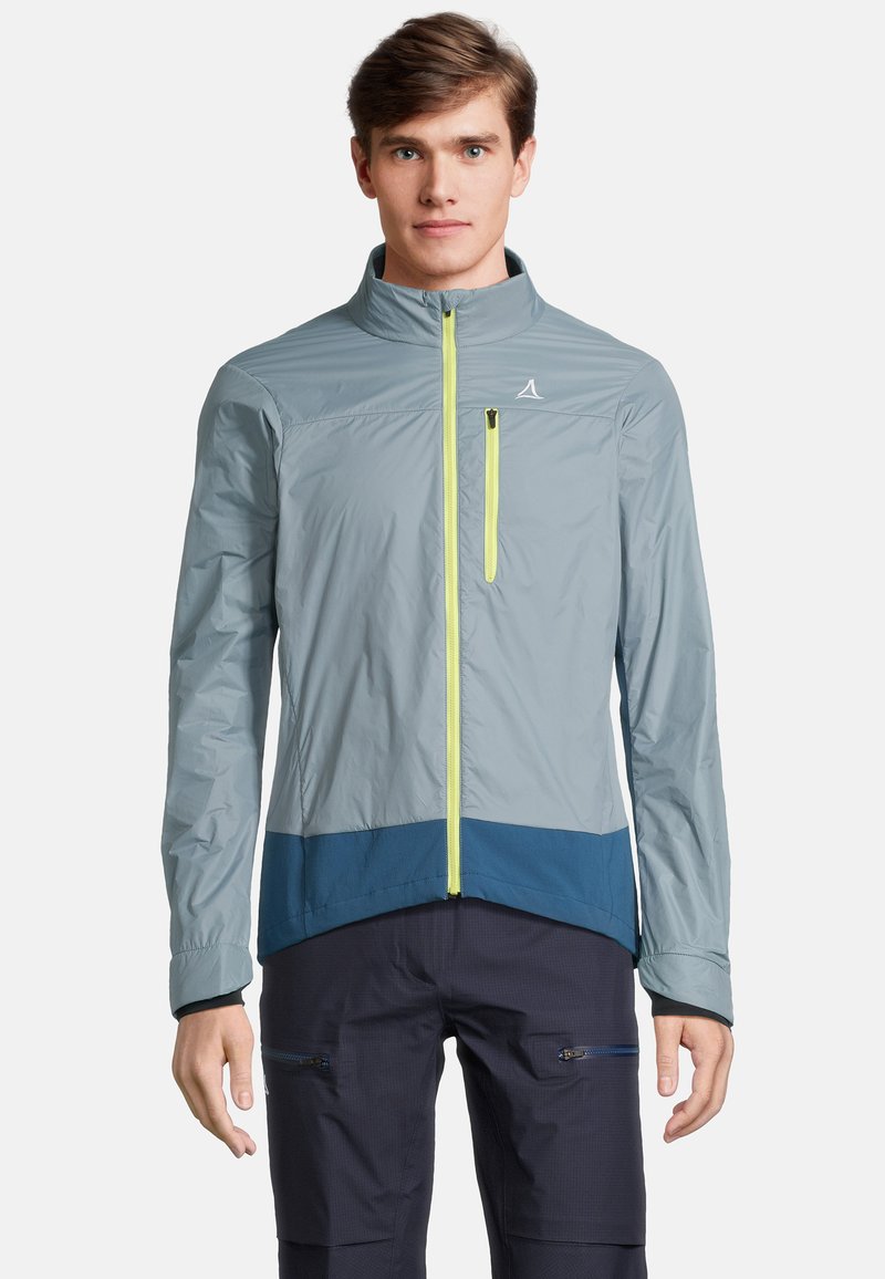 Veste de plein air légère grise avec un ourlet inférieur bleu, fermeture éclair à l'avant avec des détails en jaune néon, conçue pour les activités sportives.