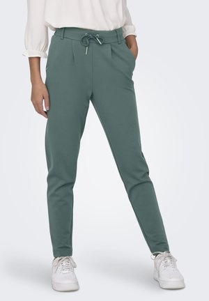 Lightweight, tapered jogger pants in muted teal, featuring an elastic waistband with a drawstring and side pockets. Cotton blend material.