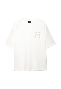 T-shirt bianco in cotone con maniche corte, scollo rotondo e tre grafiche ovali nere con testo sul lato sinistro. Tessuto liscio, vestibilità comoda.