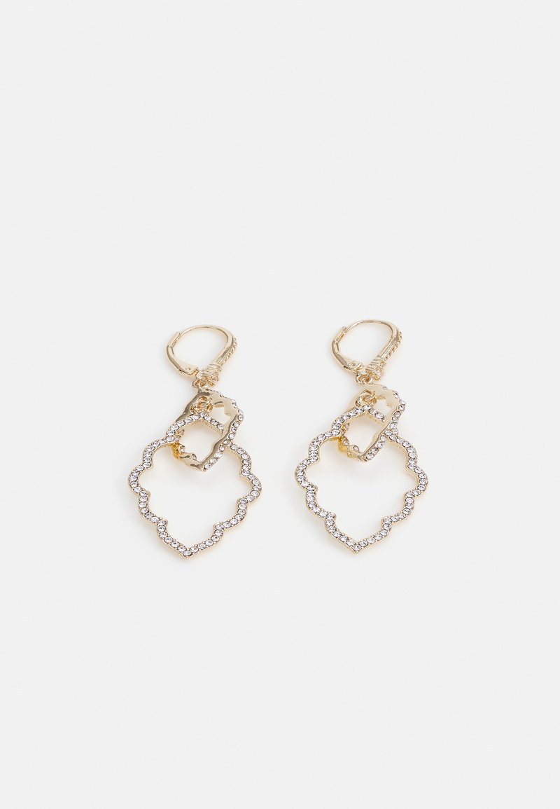 Gold earrings featuring a layered design with a scalloped outline and small stones. Fastened with a hoop clasp for secure wear.