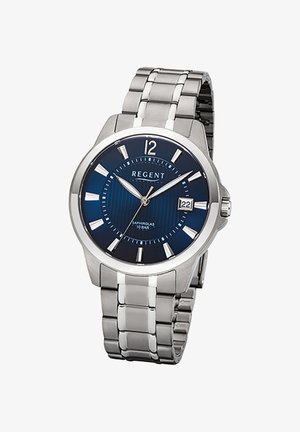 Montre homme en acier inoxydable avec cadran bleu, index argentés, affichage de la date à 3 heures et bracelet à maillons métalliques.
