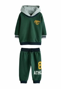 Green hooded sweatshirt with gray lining, featuring yellow text and stripes. Matching green sweatpants with yellow number "8" and white "ATHL." text.