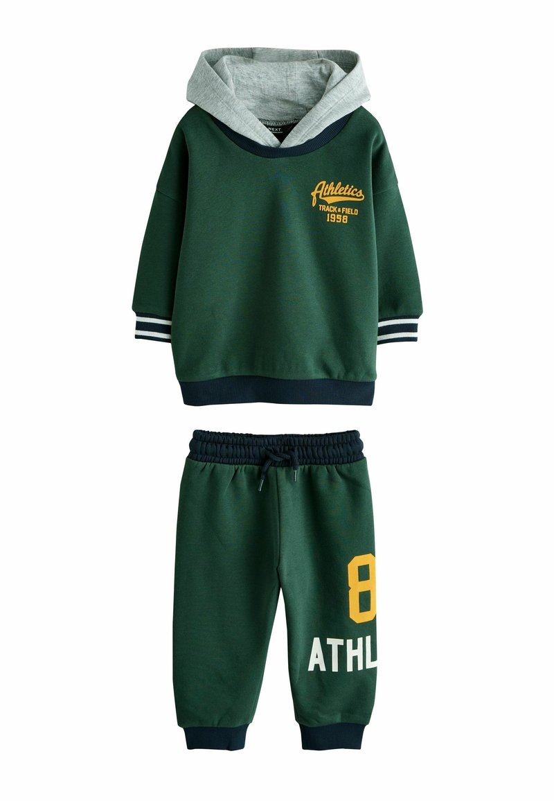 Green hooded sweatshirt with gray lining, featuring yellow text and stripes. Matching green sweatpants with yellow number "8" and white "ATHL." text.