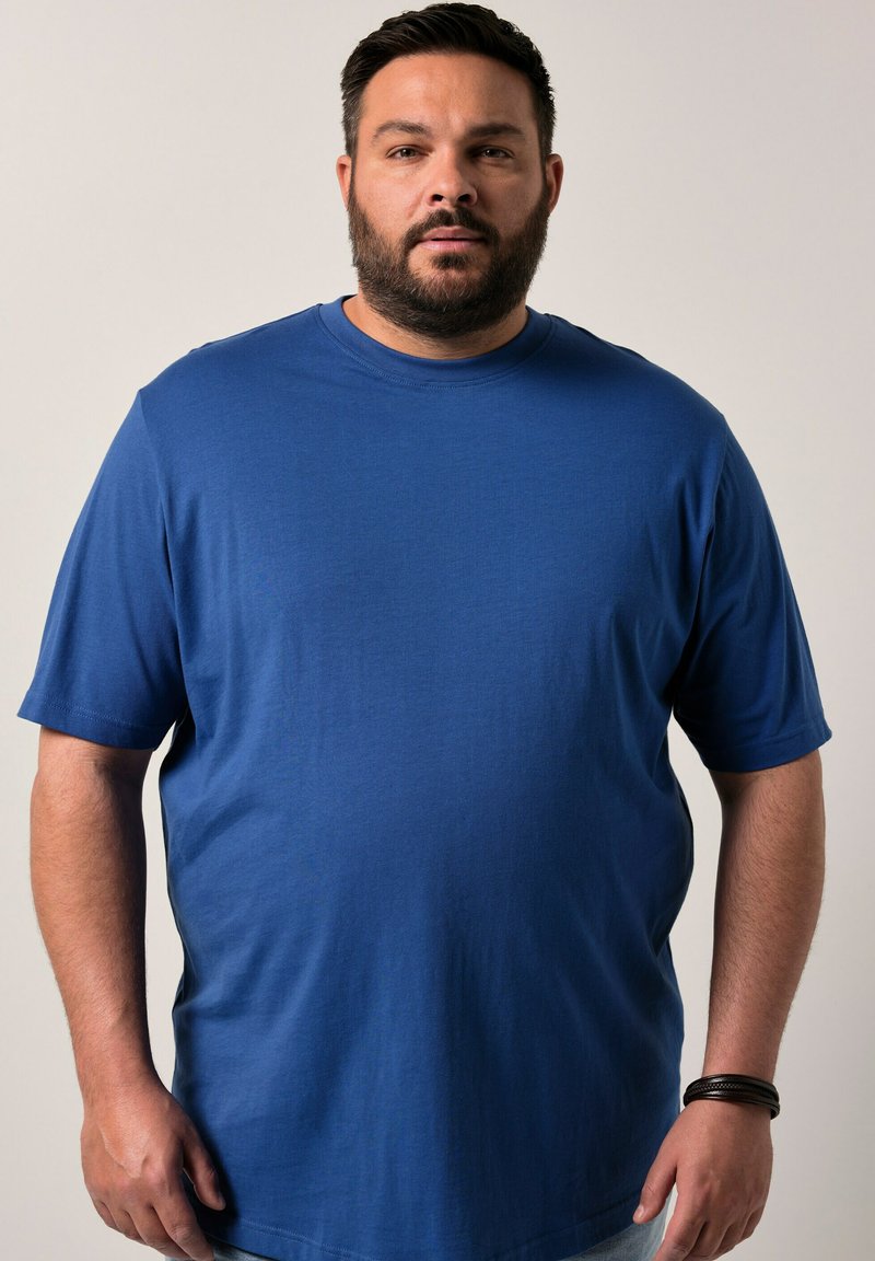 Camiseta de algodón suave de manga corta en azul royal, con un cuello redondo y un corte holgado para mayor comodidad. Sin patrones ni gráficos visibles.