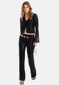 THE-ARE Chaqueta de entretiempo - black