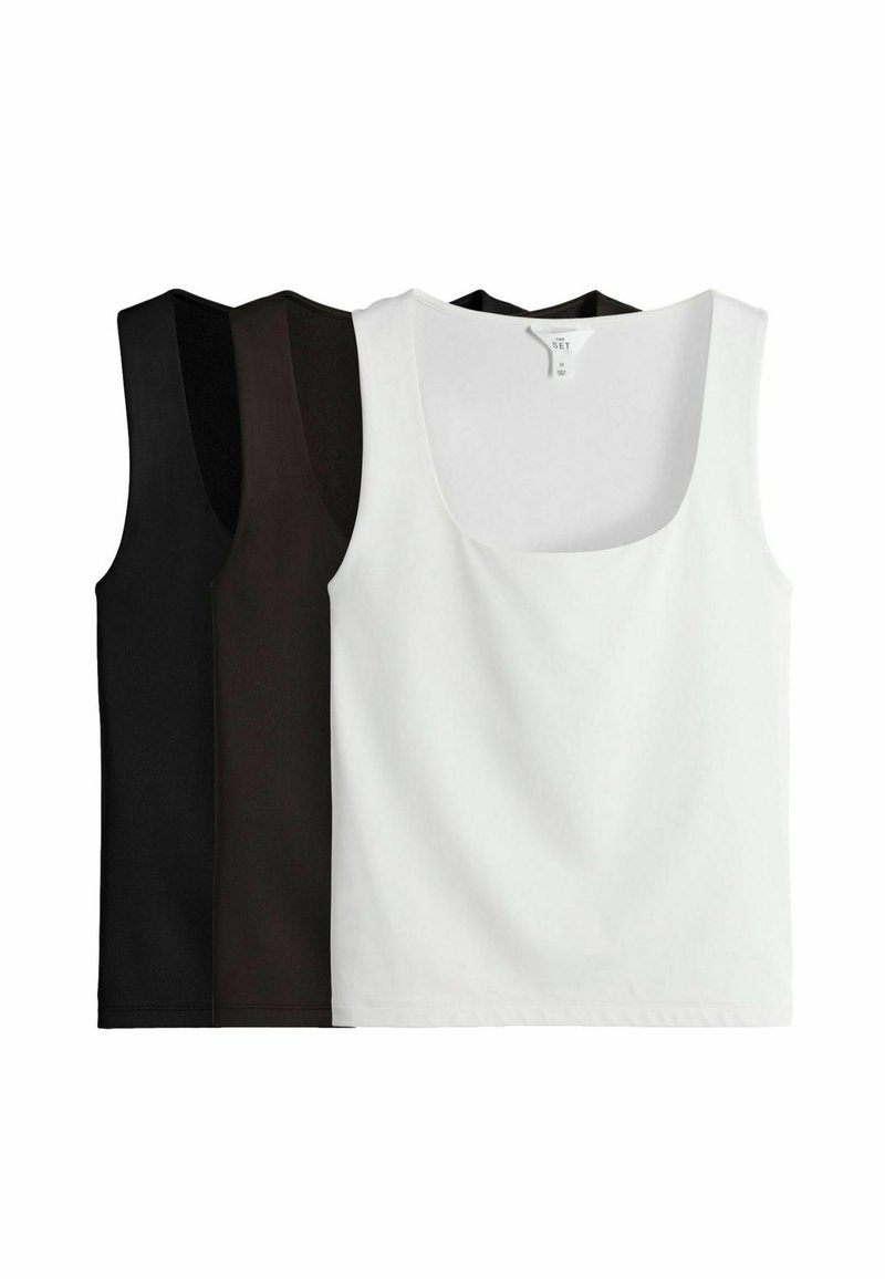 Drei ärmellose Tanktops in Schwarz und Weiß. Rundhalsausschnitt, glatte Textur und schlichtes Muster. Jedes Top ist nebeneinander angezeigt.