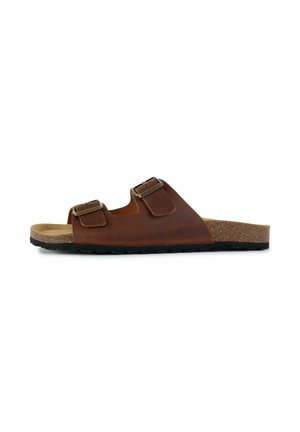 Brown leather sandal with two adjustable buckles, cork footbed, and black rubber sole, viewed from the side on a white background.