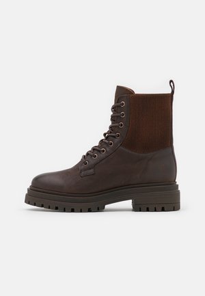 Apple of Eden Bottines à plateau - dark brown