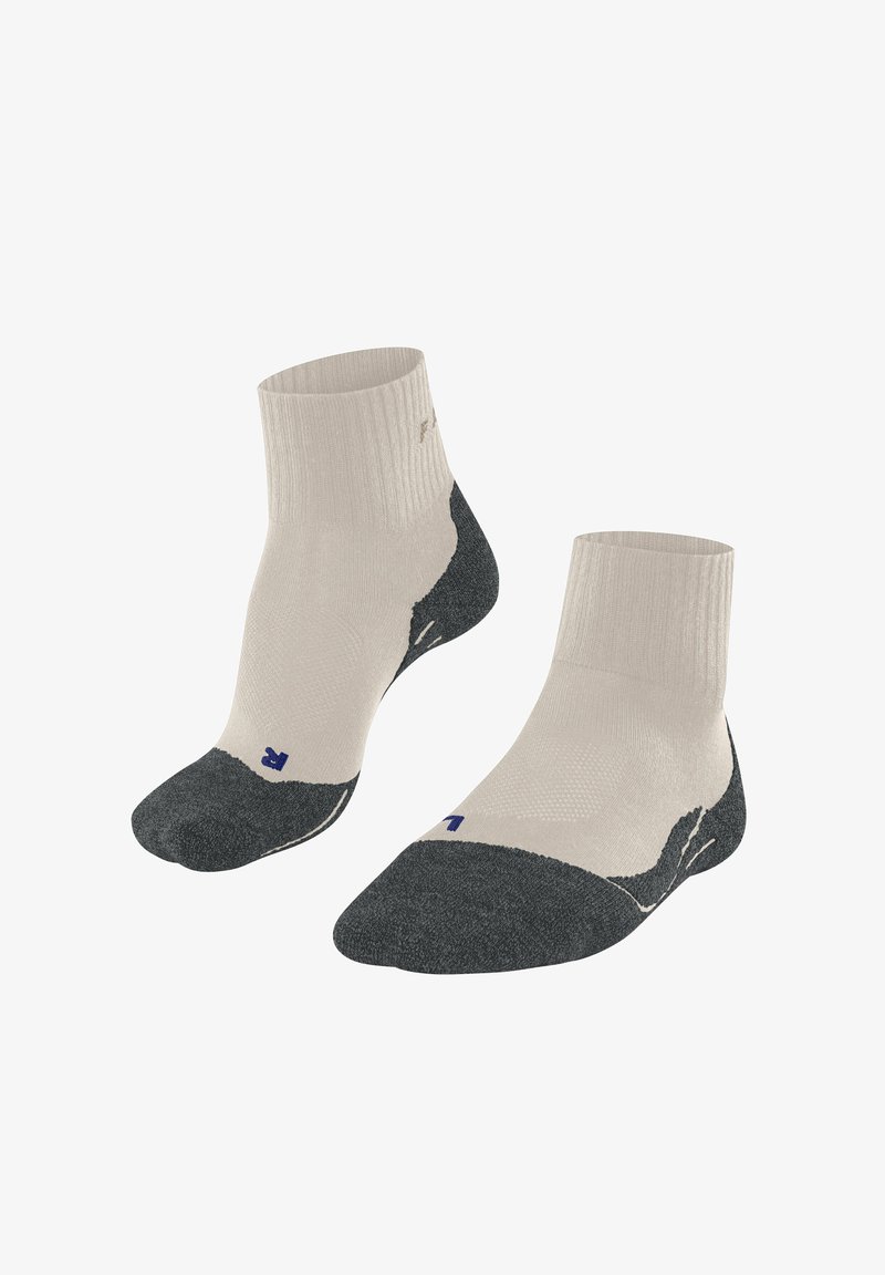Chaussettes montantes avec un haut côtelé beige et un bout et un talon renforcés gris foncé. Présente un logo bleu sur le côté extérieur.