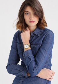 Nixon Uhr - gold-coloured