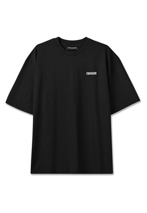 T-shirt noir à manches courtes avec col ras du cou, petit logo blanc "PEGADOR" et texte sur le côté gauche de la poitrine, présenté à plat sur fond blanc.