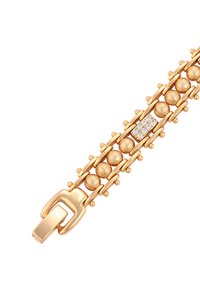 Bracciale in tono oro con perline sferiche, dettagli testurizzati e un'abbellimento simile a un diamante. Chiusura a gancio a un'estremità.