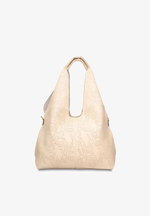 Beige leren handtas met geperforeerd geometrisch patroon en uitgeholde bovenhandgreep, voorzien van subtiele gouden hardware aan de zijkanten.