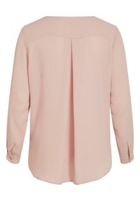 Blouse rose pâle à manches longues avec un pli dans le dos, des poignets boutonnés et un ourlet légèrement arrondi.