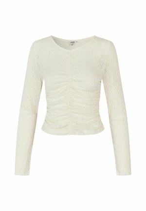 Bluză albă cu mâneci lungi, confecționată dintr-un material texturat, cu detalii adunate în față și decolteu rotund. Design cropped.