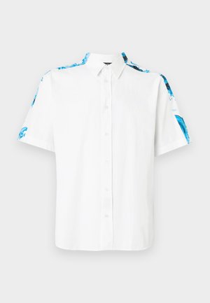 White short-sleeve button-up shirt with blue floral patterns along shoulders and sleeves, featuring a pointed collar.