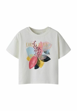 T-shirt en coton blanc présentant un design floral dans des teintes de rose, bleu, jaune et noir, avec le texte « RÊVE GRAND » en or et paillettes.