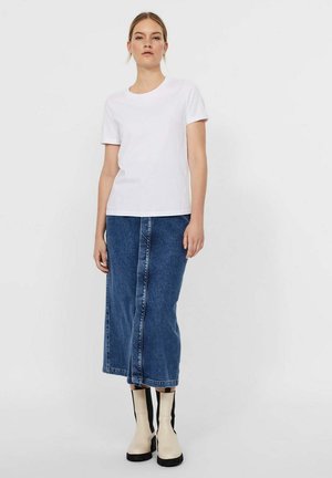 White cotton t-shirt with a round neck, paired with a knee-length denim skirt featuring a front seam and black and cream tall boots.