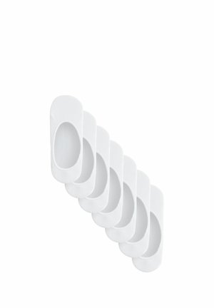 White cotton footie shoe liners with elasticized edges, featuring an oval opening for foot placement. Five pairs stacked in a row.