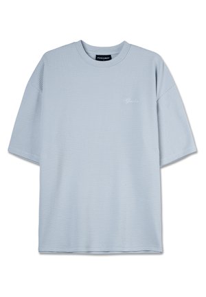 Light blue short-sleeve t-shirt with a textured waffle pattern. Features a round neck and subtle logo detail on the chest.