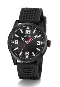 Black rubber strap watch with a textured black dial, silver hour markers, and a red second hand; features a black bezel with engraved numbers.