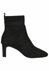 Black knitted ankle boot with a pointed toe and a tapered high heel. Features a textured upper and a flexible cuff around the ankle.