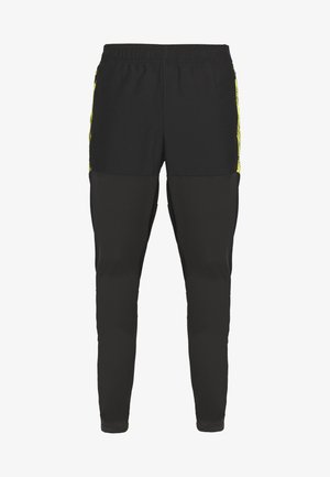 Puma FTBLNXT PRO - Jogginghose - black/ultra yellow