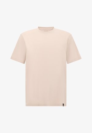 T-shirt beige clair à manches courtes avec un col rond, texture lisse et une petite étiquette de marque sur le côté inférieur. Design minimal.