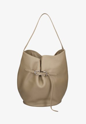 Beige leather hobo bag with a single shoulder strap and a front buckle detail with a loose hanging strap.