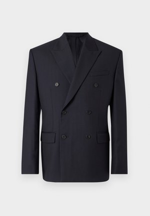 Marineblå dobbeltradet blazer med diskrete nålestriber, notched revers, to forlommer og seks sorte knapper. Skræddersyet pasform, glat tekstur.