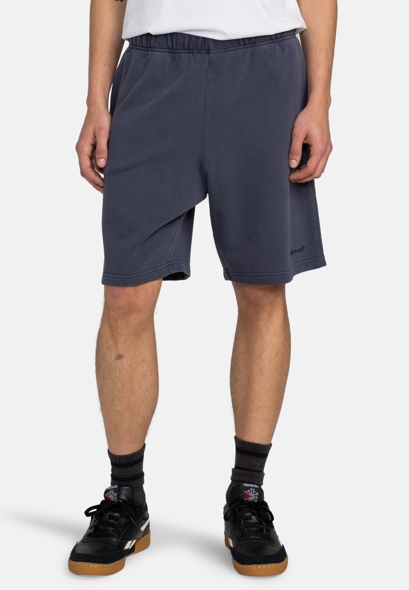 Navy blue cotton blend shorts with an elastic waistband, side pockets, and a slightly tapered leg design. Soft texture and minimal branding.