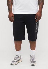 Calvin Klein - DOUBLE LOGO  - Pantalon de surv�êtement - black Image miniature 1