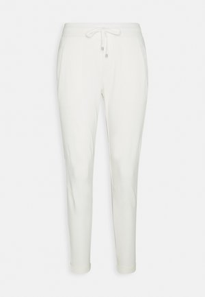 Valkoiset juoksuhousut, joissa on kiristysnyöri vyötäröllä, kaksi sivutaskua, kapeneva lahjemalli ja sileäpintainen kangas.